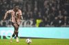 PSG's Ousmane Dembele controls the ball during the French League One soccer match between Lyon and Paris Saint-Germain at the Groupama stadium, outside Lyon, France, Sunday, Feb. 23, 2025. (AP Photo/Laurent Cipriani)