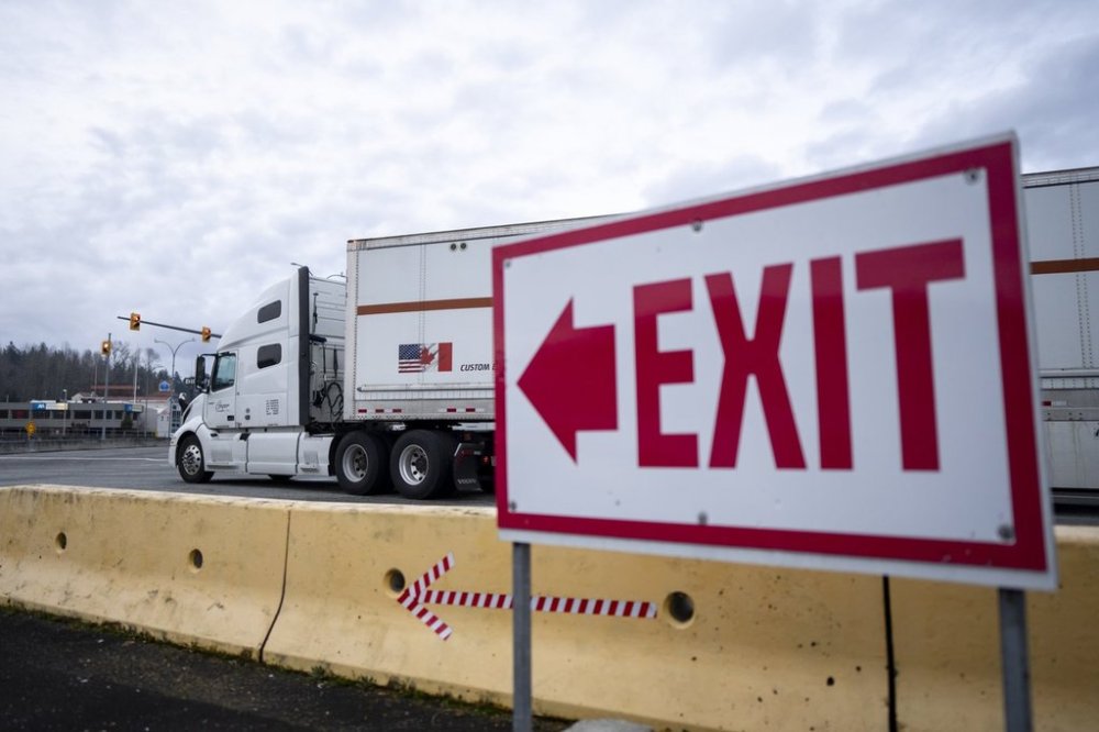 A truck waits to cross at the United States and Canada border in Surrey B.C., on Tuesday, March 4, 2025. THE CANADIAN PRESS/Ethan Cairns