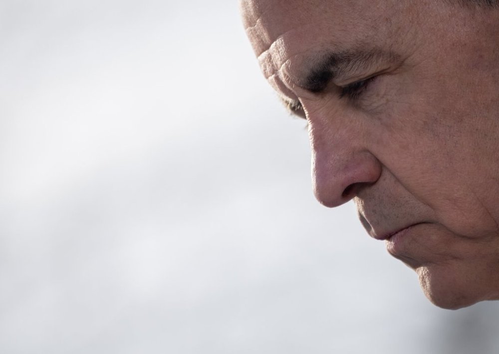 Liberal leadership candidate Mark Carney pauses as he speaks during a news conference in Vancouver, B.C., Thursday, Feb. 13, 2025. THE CANADIAN PRESS/Ethan Cairns