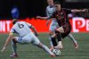 Atlanta United midfielder Miguel Almirón, front right, moves the ball against CF Montreal midfielder Samuel Piette (6) during the first half of an MLS soccer game, Saturday, Feb. 22, 2025, in Atlanta. (AP Photo/Mike Stewart)