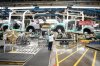 Honda employees work along the vehicle assembly line before an event announcing plans for a Honda electric vehicle battery plant in Alliston, Ont., on Thursday, April 25, 2024. THE CANADIAN PRESS/Nathan Denette