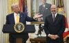 President Donald Trump speaks during a ceremonial swearing-in for Secretary of Commerce Howard Lutnick in the Oval Office of the White House in Washington on Friday, Feb. 21, 2025. THE CANADIAN PRESS/Pool via AP