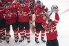 Canada captain Sidney Crosby, right, hoists the trophy after defeating the United States following an overtime period of the 4 Nations Face-Off championship hockey game, Thursday, Feb. 20, 2025, in Boston. THE CANADIAN PRESS/AP-Charles Krupa