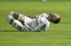 Brazil's Neymar grimaces in pain after he was fouled during his debut for Santos FC in a Sao Paulo league soccer match, against Botafogo-SP in Santos, Brazil, Wednesday, Feb. 5, 2025. (AP Photo/Andre Penner)