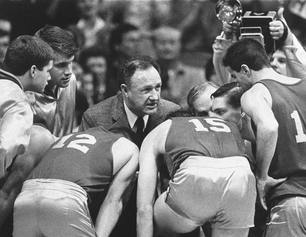 FILE - Actor Gene Hackman gives fictional Hickory High basketball players instructions during filming of the final game of the movie