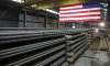 FILE - In this May 9, 2019, file photo, steel rods produced at the Gerdau Ameristeel mill in St. Paul, Minn., await shipment. (AP Photo/Jim Mone, File)