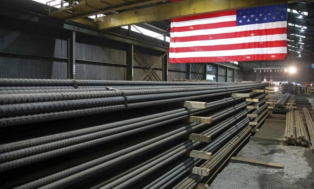 FILE - In this May 9, 2019, file photo, steel rods produced at the Gerdau Ameristeel mill in St. Paul, Minn., await shipment. (AP Photo/Jim Mone, File)
