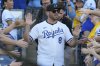 FILE - Former Kansas City Royals player Mike Moustakas greets fans during a celebration of the Royals' 2014 American League Championship before a baseball game against the Oakland Athletics, May 17, 2024, in Kansas City, Mo. (AP Photo/Charlie Riedel, File)