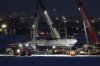 Cranes lift the wreckage of Delta Flight 4819 from the runway onto a truck at Toronto Pearson International Airport, in Mississauga, Ont., Wednesday, Feb. 19, 2025. THE CANADIAN PRESS/Arlyn McAdorey