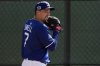Los Angeles Dodgers pitcher Blake Snell throws during spring training baseball practice, Tuesday, Feb. 18, 2025, in Phoenix. (AP Photo/Ashley Landis)