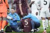 Manchester City's John Stones lies on the pitch after an injury during the Champions League playoff second leg soccer match between Real Madrid and Manchester City at the Santiago Bernabeu Stadium in Madrid, Spain, Wednesday, Feb. 19, 2025. (AP Photo/Bernat Armangue)
