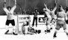 FILE - Team Canada's Phil Esposito, left, raises arms after scoring goal against Soviet Union goalie Vladislav Tretiak, on ice, in final game of series in Moscow, Sept. 28, 1972. Cheering with Esposito are Canada's Ron Ellis, right, and Paul Henderson, third from right. Other Soviets are Vladimir Lutchenko (3) and Vladimir Vikulov (18). (AP Photo/TASS, File)
