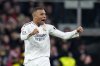 Real Madrid's Kylian Mbappe celebrates after scoring his side's first goal during a Spanish La Liga soccer match between Real Madrid and Atletico Madrid at the Santiago Bernabeu stadium in Madrid, Saturday, Feb. 8, 2025. (AP Photo/Manu Fernandez)