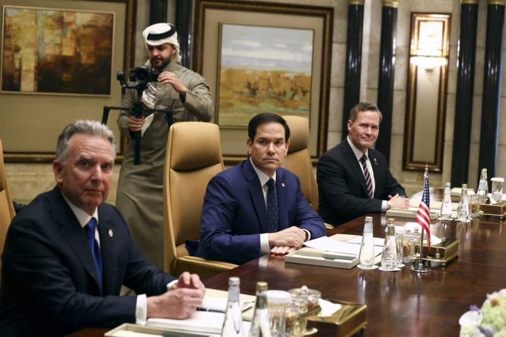 U.S. Secretary of State Marco Rubio, center, sits next to U.S. National Security Advisor Mike Waltz, right, and U.S. Middle East envoy Steve Witkoff during a meeting with Saudi Foreign Minister Prince Faisal bin Farhan Al Saud, Saudi National Security Advisor Mosaad bin Mohammad Al-Aiban, Russian Foreign Minister Sergei Lavrov and Russian President Vladimir Putin's foreign policy advisor Yuri Ushakov, at Diriyah Palace, in Riyadh, Saudi Arabia, Tuesday, Feb. 18, 2025. (Evelyn Hockstein/Pool Photo via AP)