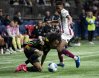 Vancouver Whitecaps' Jayden Nelson (left) and Deportivo Saprissa's Ryan Bolanos (19) vie for the ball during the second half of a CONCACAF Champions Cup soccer match in Vancouver, on Thursday, February 27, 2025. Jayden Nelson wanted to make a big impression in his return to Major League Soccer. With four assists and a goal in his first two games for the Vancouver Whitecaps, he's done just that. THE CANADIAN PRESS/Ethan Cairns