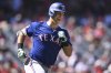 FILE - Texas Rangers' Nathaniel Lowe runs the bases after hitting a home run during the eighth inning of a baseball game against the Los Angeles Angels, Sunday, Sept. 29, 2024, in Anaheim, Calif. (AP Photo/John McCoy, File)