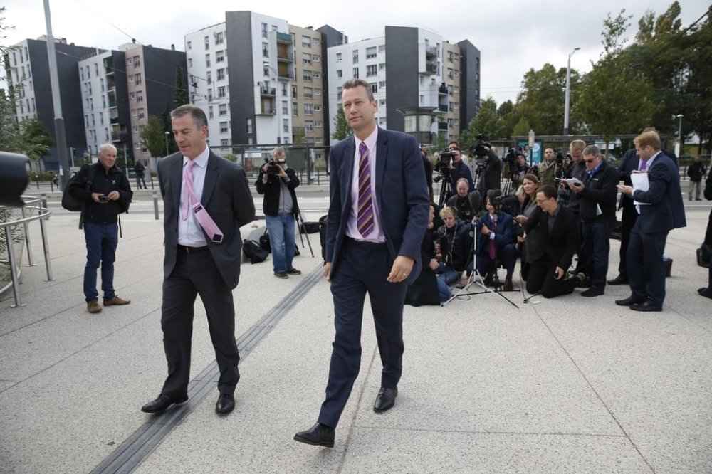 FILE - Nathan Gill, UKIP spokesman for Wales, right, and spokesman Hermann Kelly walk away after speaking to journalists in front of the Hospital De Hautepierre in Strasbourg, eastern France, Oct. 7, 2016. (AP Photo/Jean-Francois Badias, File)
