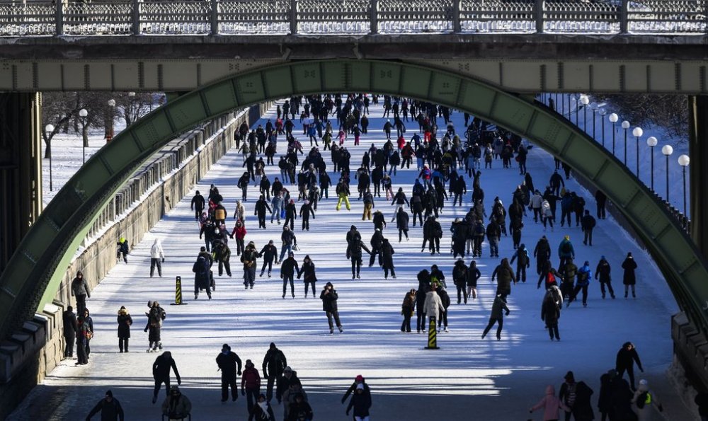 People skate on the Rideau Canal on the first weekend of the Winterlude festival in Ottawa, on Saturday, Feb. 1, 2025. The Rideau Canal is a UNESCO World Heritage Site. THE CANADIAN PRESS/Justin Tang
