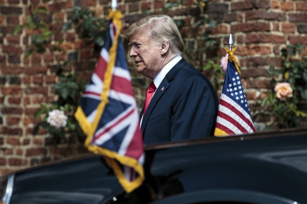 FILE - President Donald Trump arrives to meet British Prime Minister Theresa May before their meeting at Chequers, in Buckinghamshire, England, July 13, 2018. (Jack Taylor/Pool Photo via AP, File)