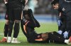 Chelsea's Noni Madueke reacts after an injury during the English Premier League soccer match between Brighton and Chelsea in Brighton, England, Friday, Feb. 14, 2025. (AP Photo/Dave Shopland)