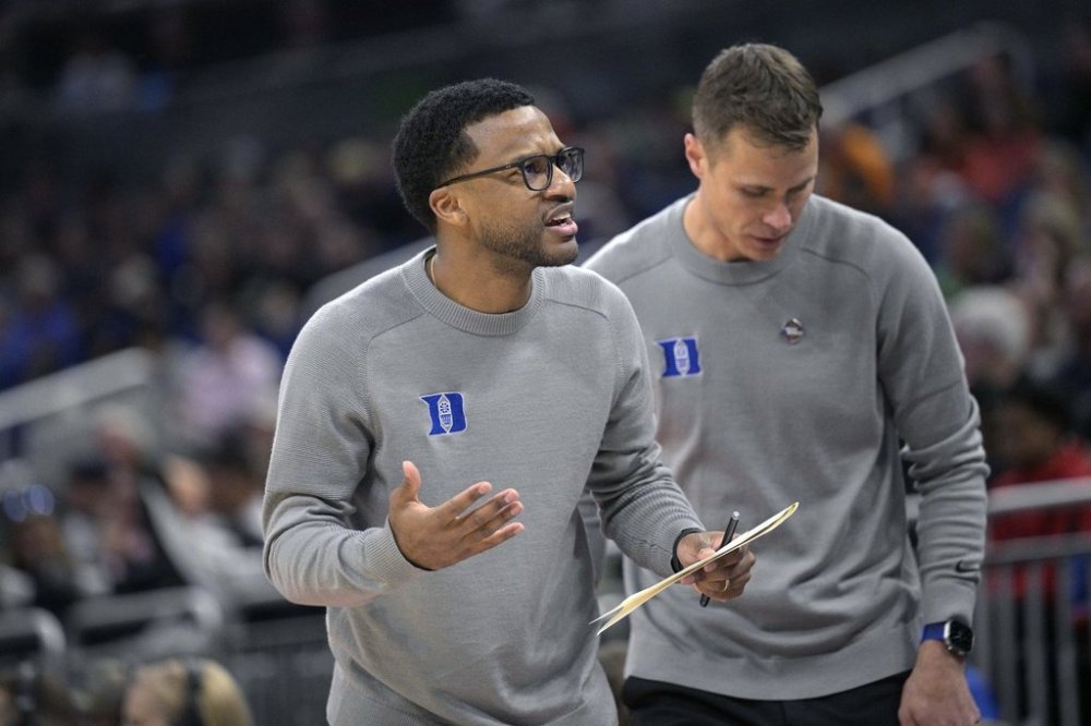 FILE - Duke assistant coach Jai Lucas, left, and head coach Jon Scheyer work during the first half of a first-round college basketball game against Oral Roberts in the NCAA Tournament, March 16, 2023, in Orlando, Fla. (AP Photo/Phelan M. Ebenhack, File)
