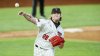 FILE - Texas Tech pitcher Chase Hampton (28) throws to first in an attempt to force out Mississippi State's Rowdey Jordan (4) during an NCAA baseball game, Feb. 22, 2021, in Arlington, Texas. (AP Photo/Brandon Wade, File)