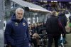 Fenerbahce's head coach Jose Mourinho, left, during the Europa League playoff second leg soccer match between Anderlecht and Fenerbahce at the RSC Anderlecht stadium in Brussels, Thursday, Feb. 20, 2025. (AP Photo/Omar Havana)