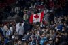 A Whitecaps fan waves a Canadian flag during the first half of an MLS soccer match in Vancouver, B.C., Sunday, March 2, 2025. THE CANADIAN PRESS/Ethan Cairns