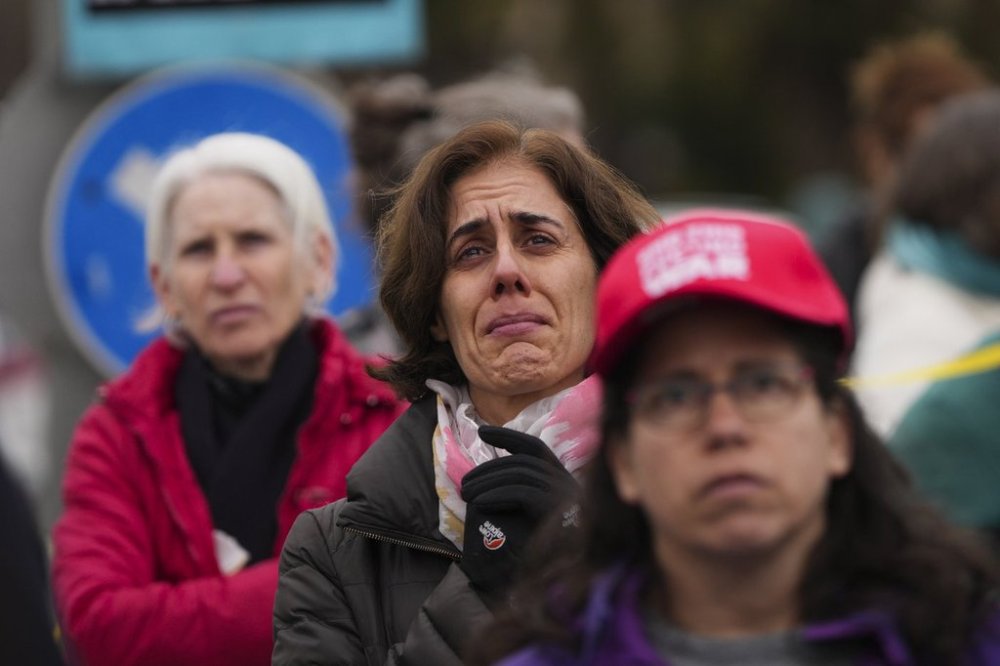 Relatives and supporters of hostages held by Hamas in the Gaza Strip protest outside the prime minister's office in Jerusalem on Tuesday, Feb. 11, 2025. after Hamas announced it would delay a planned hostage release after accusing Israel of violating a fragile ceasefire. (AP Photo/Ohad Zwigenberg)