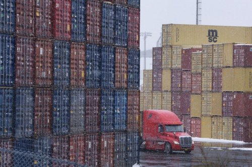 Shipping containers are seen at the Atlantic Hub container terminal in Halifax on Monday, Feb. 3, 2025. After a choppy couple of years for Canada's largest ports, a new paper argues that automation provides a path to higher productivity. THE CANADIAN PRESS/Darren Calabrese