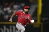 FILE - Los Angeles Angels' Anthony Rendon sprints to third during a baseball game against the Texas Rangers, Sept. 6, 2024, in Arlington, Texas. (AP Photo/Tony Gutierrez, File)