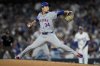 FILE - New York Mets pitcher Kodai Senga throws against the Los Angeles Dodgers during the seventh inning in Game 6 of a baseball NL Championship Series, Oct. 20, 2024, in Los Angeles. (AP Photo/Ashley Landis, File)