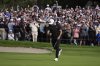 Ludvig Åberg, of Sweden, celebrates after making a birdie putt on the 18th green of the South Course at Torrey Pines during the final round of the Genesis Invitational golf tournament Sunday, Feb. 16, 2025, in San Diego. (AP Photo/Gregory Bull)