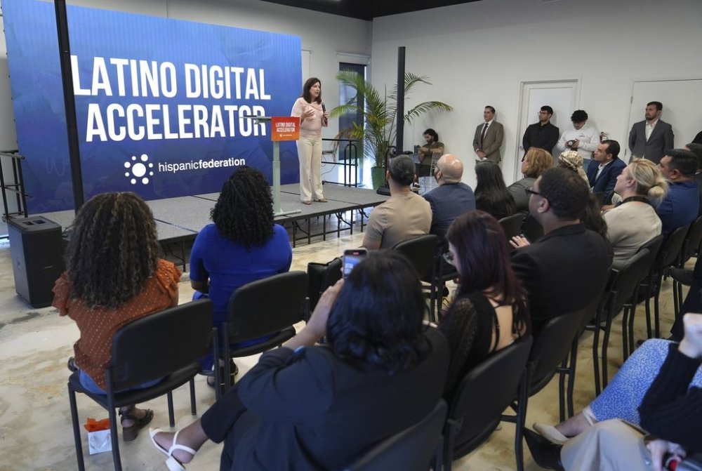 Vicky Lazo, a teacher with Southwest Miami Senior High School, speaks Tuesday, Jan. 28, 2025, in Miami during a Hispanic Federation event where they announced a new investment from Google.org to provide workforce development workshops to help Latinos learn digital skills. (AP Photo/Lynne Sladky)