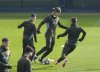 Manchester City's Erling Haaland, centre, attends a training session at the City Football Academy, Manchester, England, Tuesday, Feb. 18, 2025, ahead of the Champions League playoff second leg soccer match between Real Madrid and Manchester City. (Martin Rickett/PA via AP)