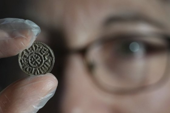 An early medieval silver penny of Guthrum of East Anglia, the first silver coin minted by a Viking ruler in Britain, is displayed at the British Museum's annual treasure launch in London, Tuesday. (Kirsty Wigglesworth / The Associated Press)