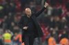 Liverpool's manager Arne Slot greets the crowd after winning the English League Cup semifinal second leg soccer match between Liverpool and Tottenham Hotspur at Anfield Stadium in Liverpool, England, Thursday, Feb. 6, 2025. (AP Photo/Jon Super)