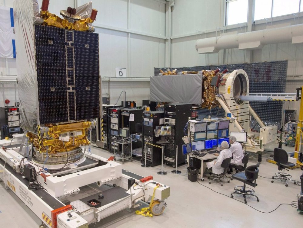 Technicians put the final touches on two of three Radarsat Constellation Mission satellites at the MDA facility Thursday, June 21, 2018 in Montreal. THE CANADIAN PRESS/Ryan Remiorz