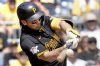 FILE - Pittsburgh Pirates' Connor Joe hits a single during the second inning of a baseball game against the Chicago Cubs, in Pittsburgh, Aug. 28, 2024. (AP Photo/Matt Freed, File)