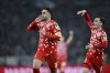 Mainz' Nadiem Amiri celebrates after scoring with teammate Paul Nebel during the German Bundesliga soccer match between Borussia Moenchengladbach and 1. FSV Mainz 05 at Borussia-Park stadium in Moenchengladbach, Germany, Friday, March 7, 2025. (Fabian Strauch/dpa via AP)