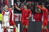 Munich's Hiroki Ito, center, celebrates scoring with Eric Dier, left, and Jamal Musiala during the Bundesliga soccer match between Bayern Munich and Eintracht Frankfurt at the Allianz Arena, Munich, Germany, Sunday Feb. 23, 2025. (Sven Hoppe/dpa via AP)