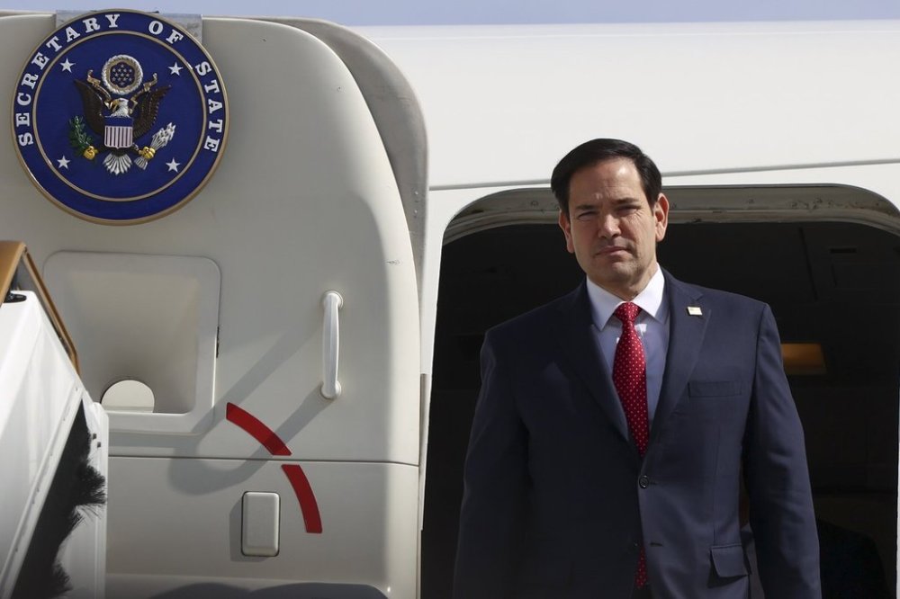 U.S. Secretary of State Marco Rubio disembarks from an aircraft, in Abu Dhabi, United Arab Emirates, Wednesday, Feb. 19, 2025. (Evelyn Hockstein/Pool Photo via AP)