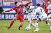 St. Pauli's James Sands dribbles past Heidenheim's Luca Kerber, left, during the German Bundesliga soccer match between 1. FC Heidenheim and FC St. Pauli in Munich, Germany, Saturday, Jan. 18, 2025.(Harry Langer/dpa via AP, File)