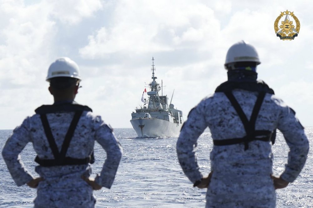 FILE - In this handout photo provided by Public Affairs Office Armed Forces of the Philippines, Philippine Navy personnel watch the Canadian vessel HMCS Montreal (FFH336) during the Multilateral Maritime Cooperative Activity being held in the West Philippine Sea, on Wednesday, Aug. 7, 2024. (Private First Class Carmelotes/Public Affairs Office Armed Forces of the Philippines via AP, File)