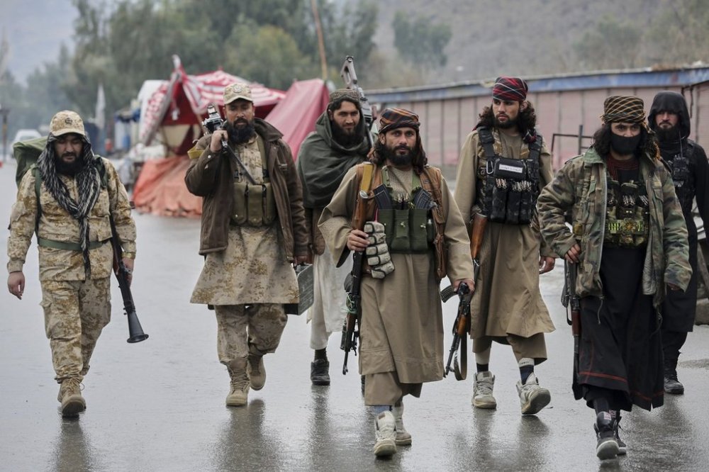 Taliban fighters patrol near the closed Torkham border with Pakistan, where Pakistani and Afghan forces exchanged fire overnight, in Torkham, Afghanistan, Monday, March 3, 2025.(AP Photo/Shafiullah Kakar)