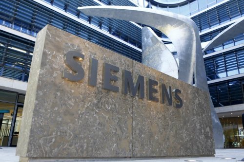 FILE - In this June 24, 2016 file photo the logo of German industrial conglomerate Siemens is pictured prior to the opening ceremony at the new headquarters in Munich, Germany. (AP Photo/Matthias Schrader, file)