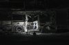 An Israeli police officer inspects the scene of one of a series of bus explosions in what authorities said appeared to be a militant attack in Bat Yam, central Israel, Thursday, Feb. 20, 2025. (AP Photo/Ohad Zwigenberg)