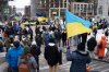 Demonstrators fly Ukrainian flags while rallying in Halifax on Sunday, Feb. 23, 2025 during a global day of action marking the third anniversary of Russia’s invasion of Ukraine. THE CANADIAN PRESS/Darren Calabrese