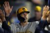 FILE - Milwaukee Brewers' Christian Yelich celebrates in the dugout after scoring against the Los Angeles Angels during the eighth inning of a baseball game Wednesday, June 19, 2024, in Anaheim, Calif. (AP Photo/Ryan Sun, File)