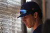 Milwaukee Brewers left fielder Christian Yelich looks down in a dugout as teammates take live batting practice during spring training baseball practice at the team's training facility Friday, Feb. 21, 2025, in Phoenix. (AP Photo/Lindsey Wasson)